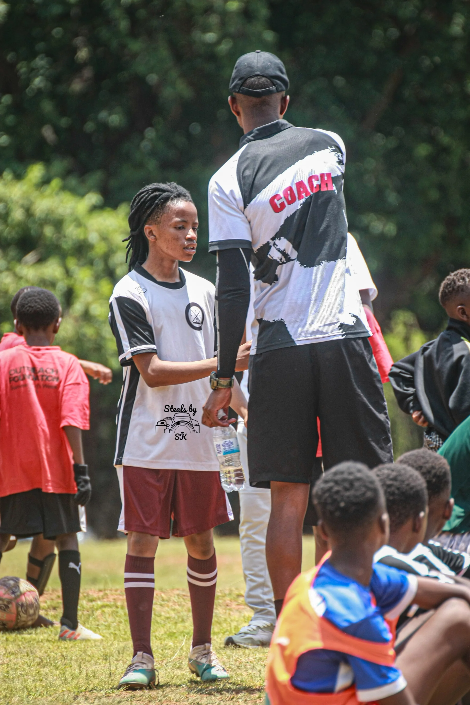 Young player kicking ball